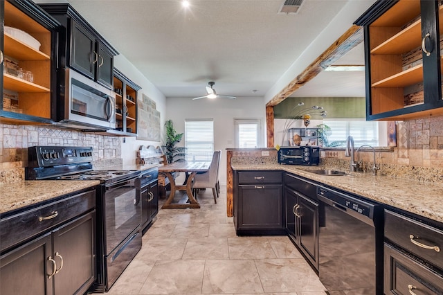 103 Presidents Way, Venus, TX 76084 - kitchen featuring open shelves, dishwashing machine, stainless steel microwave, black electric range oven, and a sink
