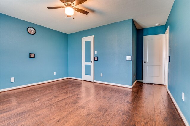 103 Presidents Way, Venus, TX 76084 - empty room featuring wood finished floors, ceiling fan, and baseboards