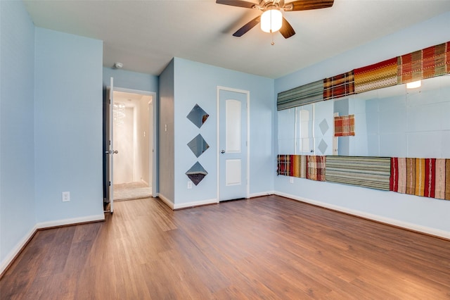 103 Presidents Way, Venus, TX 76084 - spare room with wood finished floors, a ceiling fan, and baseboards