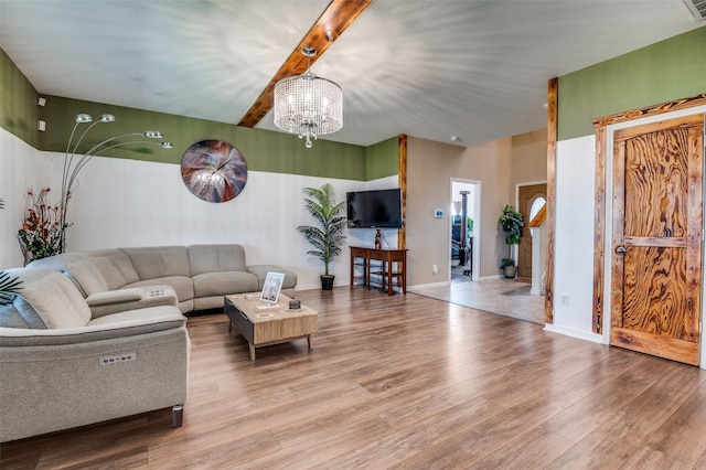 103 Presidents Way, Venus, TX 76084 - living room featuring a chandelier, wood finished floors, and beam ceiling