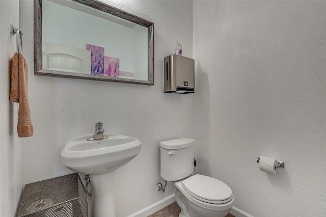 103 Presidents Way, Venus, TX 76084 - half bathroom with toilet, baseboards, tile patterned flooring, and a sink