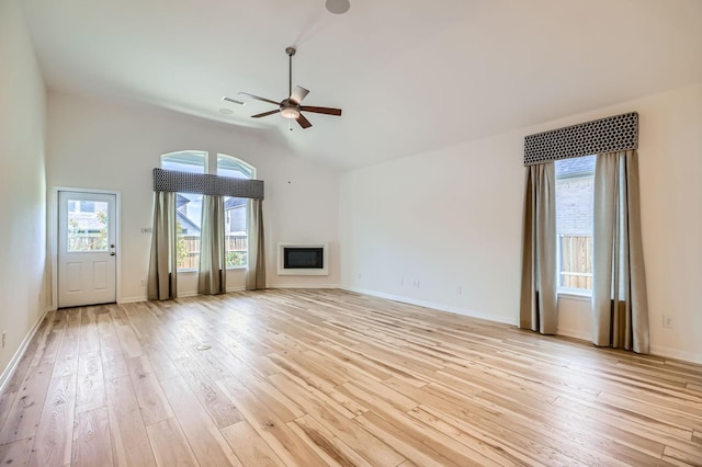 17204 Clover Dr, Celina, TX 75009 - unfurnished living room featuring a ceiling fan, lofted ceiling, light wood finished floors, and baseboards