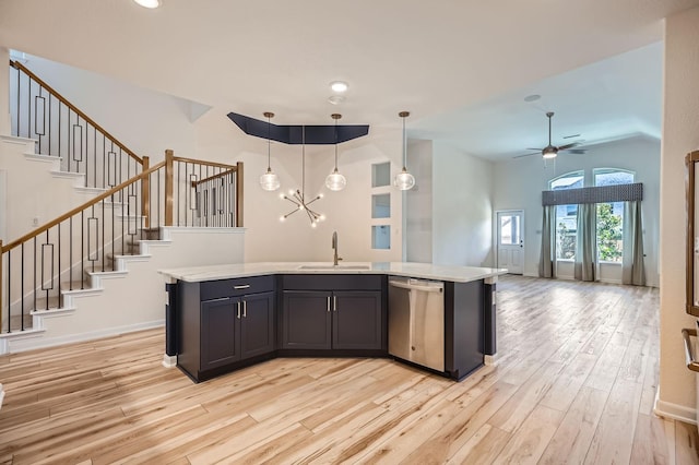 17204 Clover Dr, Celina, TX 75009 - kitchen with dishwasher, a sink, light wood-type flooring, light countertops, and open floor plan