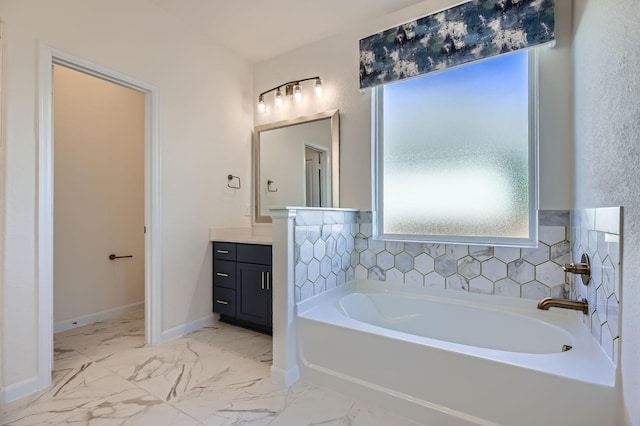 17204 Clover Dr, Celina, TX 75009 - full bathroom with vanity, a garden tub, baseboards, and marble look tiles