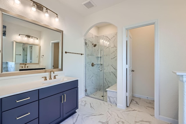17204 Clover Dr, Celina, TX 75009 - bathroom featuring a marble finish shower, marble finish floors, vanity, and baseboards