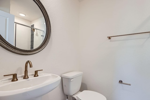17204 Clover Dr, Celina, TX 75009 - bathroom with a sink, toilet, and tiled shower