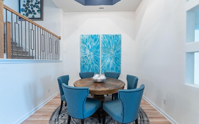 17204 Clover Dr, Celina, TX 75009 - dining room with wood finished floors, baseboards, and stairway