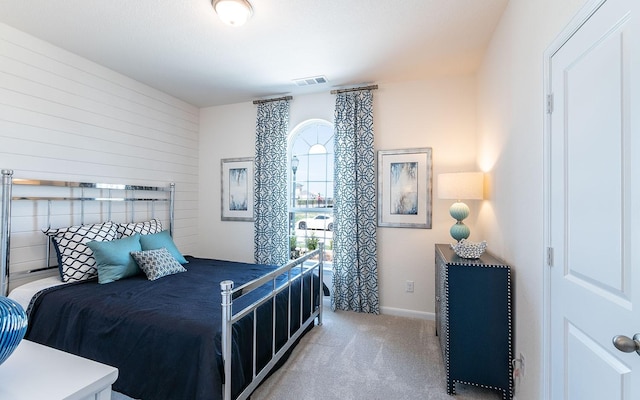 17204 Clover Dr, Celina, TX 75009 - bedroom with multiple windows, carpet, baseboards, and wooden walls