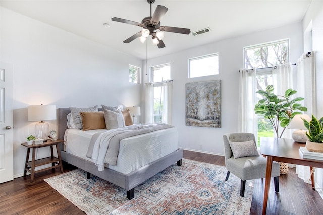 11471 Balcones Dr, Frisco, TX 75033 - bedroom with dark wood finished floors, baseboards, and a ceiling fan