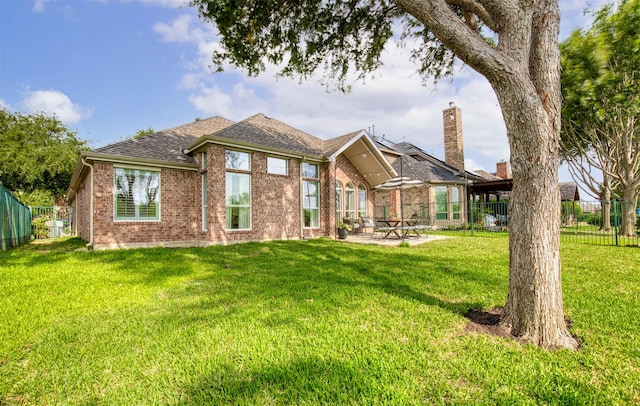 11471 Balcones Dr, Frisco, TX 75033 - rear view of house with brick siding, a patio area, and roof with shingles