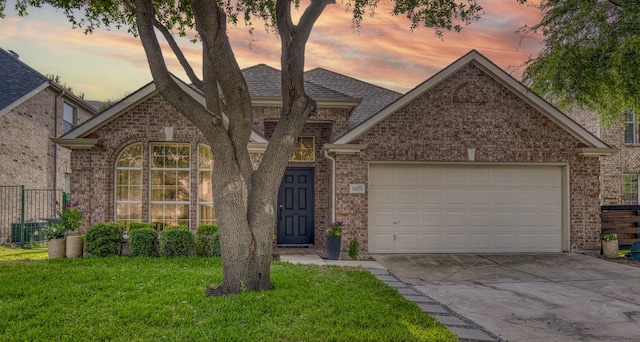11471 Balcones Dr, Frisco, TX 75033 - view of front of house with concrete driveway, brick siding, an attached garage, and a shingled roof
