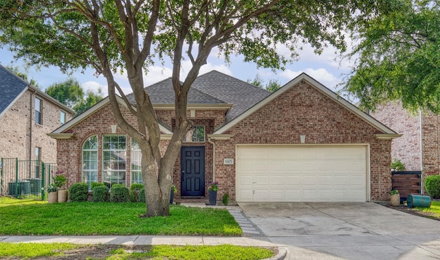 11471 Balcones Dr, Frisco, TX 75033 - traditional home with driveway, a garage, brick siding, and roof with shingles