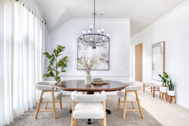 11471 Balcones Dr, Frisco, TX 75033 - dining space featuring a chandelier, lofted ceiling, and crown molding