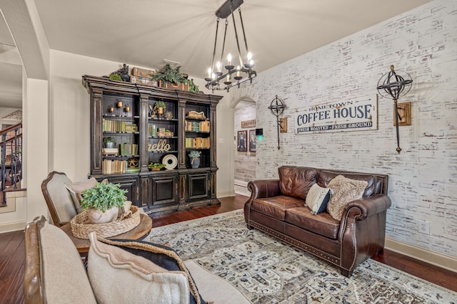 1702 Clarke Springs Dr, Allen, TX 75002 - living room with baseboards, arched walkways, and wood finished floors