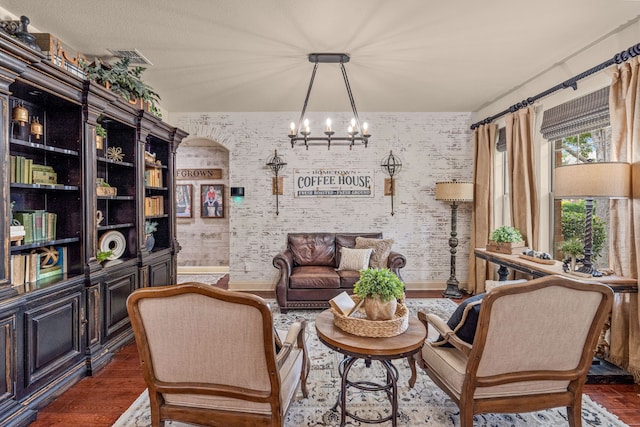 1702 Clarke Springs Dr, Allen, TX 75002 - sitting room featuring a chandelier, wood finished floors, and baseboards