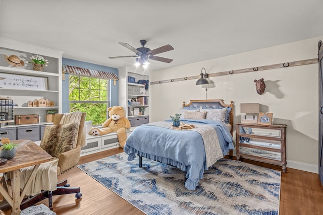 1702 Clarke Springs Dr, Allen, TX 75002 - bedroom with wood finished floors and a ceiling fan
