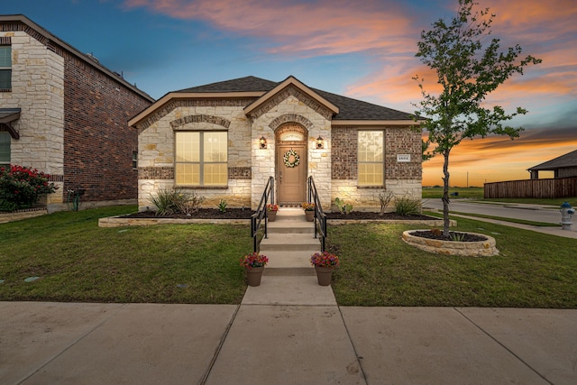 1601 Bennington Ln, Celina, TX 75009 - french provincial home with stone siding, a lawn, and a shingled roof