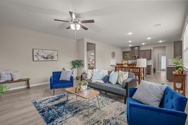 1601 Bennington Ln, Celina, TX 75009 - living area featuring baseboards, ceiling fan, recessed lighting, and light wood-style floors