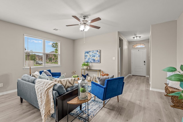 1601 Bennington Ln, Celina, TX 75009 - living room with light wood-style floors, baseboards, and a ceiling fan