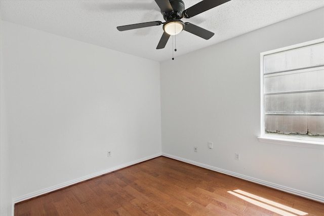 3622 Emerald Dr, Mesquite, TX 75150 - spare room featuring wood finished floors and a ceiling fan