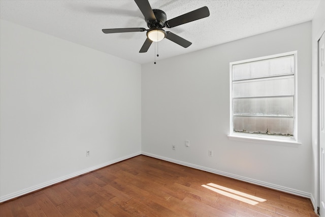 3622 Emerald Dr, Mesquite, TX 75150 - empty room with wood finished floors and a ceiling fan