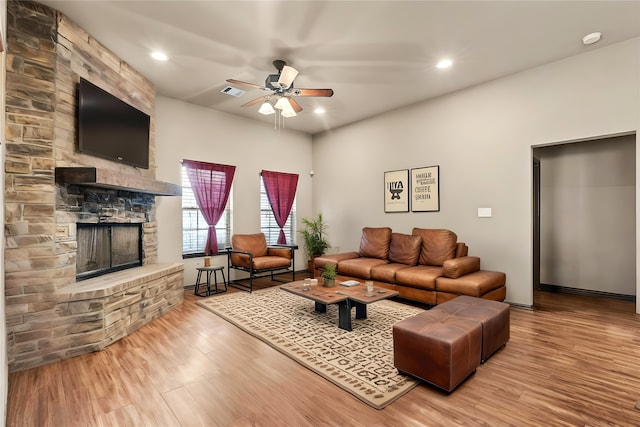 4905 Lakepark Dr, Sanger, TX 76266 - living room with ceiling fan, wood finished floors, a stone fireplace, recessed lighting, and baseboards