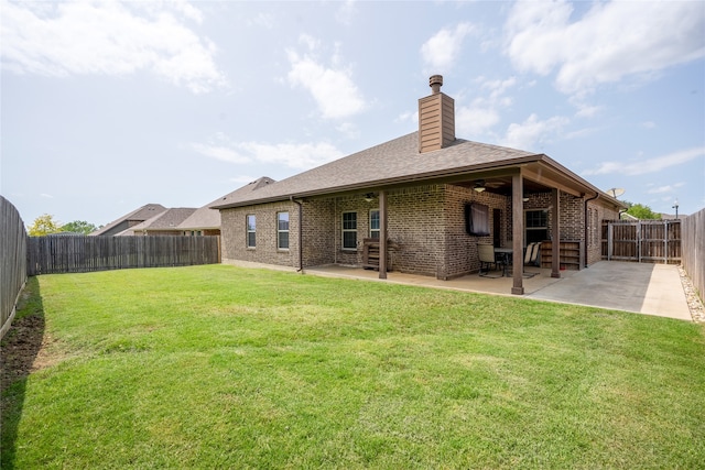 4905 Lakepark Dr, Sanger, TX 76266 - rear view of house featuring ceiling fan, a patio area, brick siding, and a chimney
