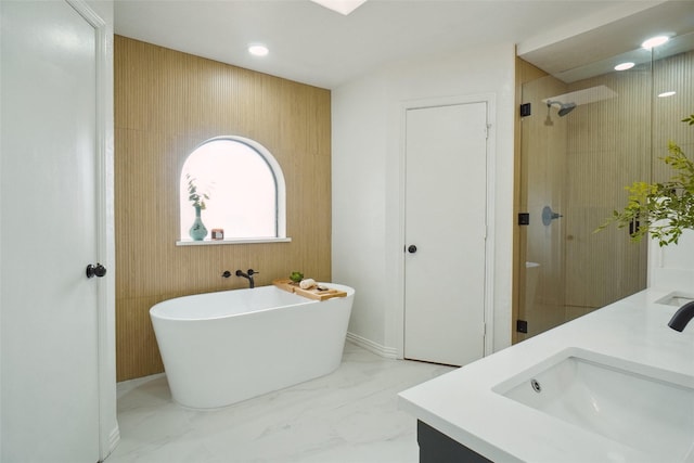 6420 Green Ridge Dr, Watauga, TX 76148 - bathroom featuring a soaking tub, double vanity, a shower stall, and recessed lighting