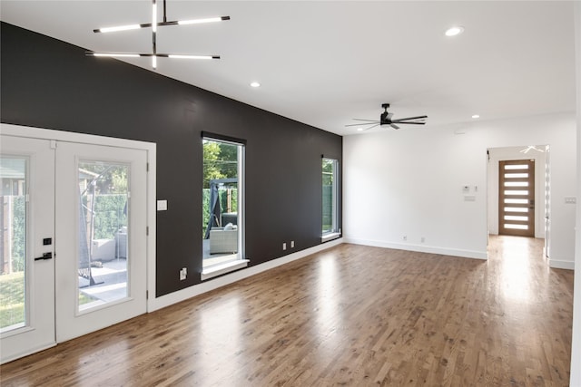 3502 Vilbig Rd, Dallas, TX 75212 - unfurnished living room featuring wood finished floors, recessed lighting, a ceiling fan, and baseboards