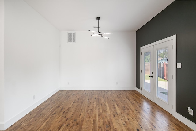 3502 Vilbig Rd, Dallas, TX 75212 - unfurnished dining area with french doors, wood finished floors, and baseboards