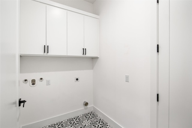 3502 Vilbig Rd, Dallas, TX 75212 - washroom with electric dryer hookup, cabinet space, baseboards, hookup for a gas dryer, and tile patterned flooring