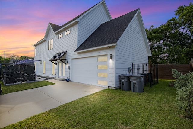 3502 Vilbig Rd, Dallas, TX 75212 - property exterior at dusk featuring driveway, roof with shingles, and a garage