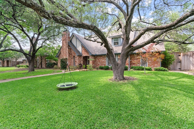 10007 Silver Creek Rd, Dallas, TX 75243 - view of front of property featuring brick siding, a chimney, and a shingled roof