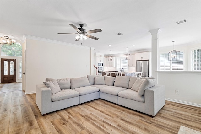 4804 Arbor Glen Dr, Mckinney, TX 75072 - living area with plenty of natural light, light wood-type flooring, a chandelier, crown molding, and recessed lighting