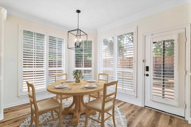 4804 Arbor Glen Dr, Mckinney, TX 75072 - dining space with crown molding, a chandelier, and light wood-style floors