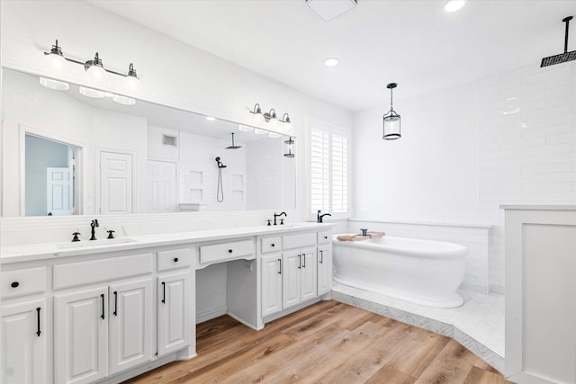 4804 Arbor Glen Dr, Mckinney, TX 75072 - full bath with double vanity, a soaking tub, walk in shower, wood finished floors, and recessed lighting