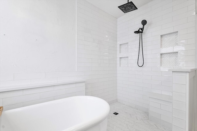 4804 Arbor Glen Dr, Mckinney, TX 75072 - bathroom with tile walls, a freestanding bath, and tiled shower