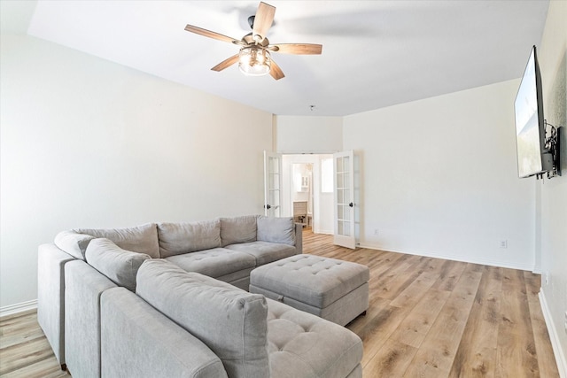 4804 Arbor Glen Dr, Mckinney, TX 75072 - living room with french doors, light wood-type flooring, a ceiling fan, and baseboards