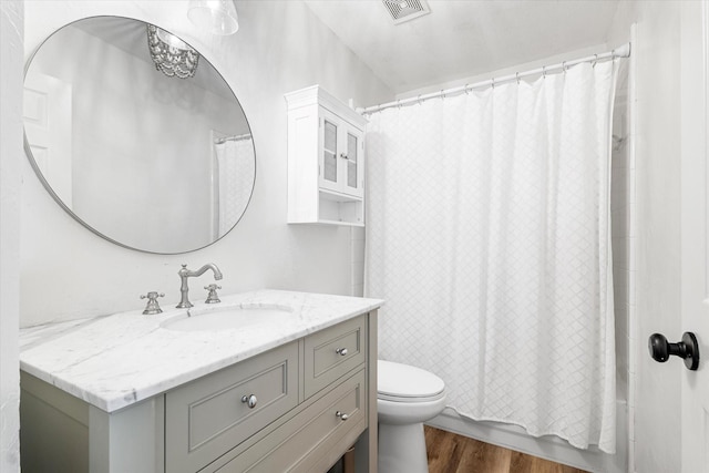 4804 Arbor Glen Dr, Mckinney, TX 75072 - full bath with vanity, wood finished floors, toilet, and shower / bathtub combination with curtain