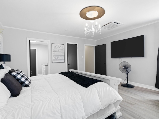 910 N Mill St, Bowie, TX 76230 - bedroom featuring ornamental molding, a chandelier, light wood-type flooring, baseboards, and ensuite bath