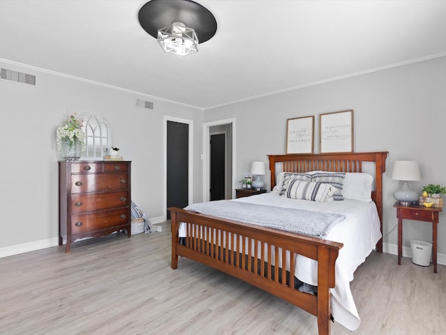 910 N Mill St, Bowie, TX 76230 - bedroom with wood finished floors, baseboards, and crown molding