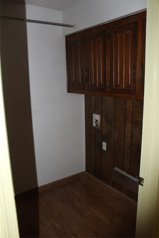 1424 Valley Trl, Mesquite, TX 75149 - laundry area with cabinet space, washer hookup, wood finished floors, and baseboards