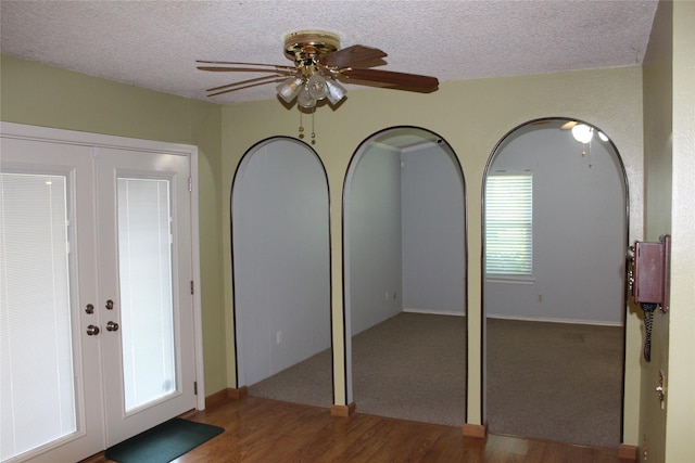1424 Valley Trl, Mesquite, TX 75149 - entryway with french doors, a ceiling fan, wood finished floors, and a textured ceiling