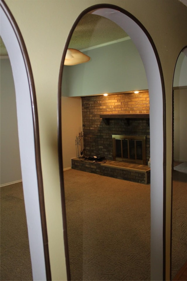 1424 Valley Trl, Mesquite, TX 75149 - living room with carpet floors, a brick fireplace, and crown molding