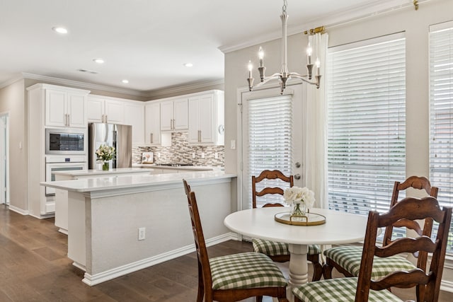 726 Nettleton Dr, Southlake, TX 76092 - dining room with dark wood finished floors, crown molding, a chandelier, recessed lighting, and baseboards