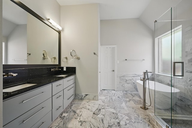 14877 Snowshill Dr, Frisco, TX 75035 - bathroom featuring marble tiled floors, double vanity, a soaking tub, a marble finish shower, and vaulted ceiling