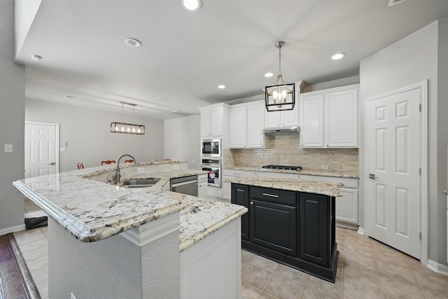 14877 Snowshill Dr, Frisco, TX 75035 - kitchen with a large island, a sink, a chandelier, appliances with stainless steel finishes, and recessed lighting