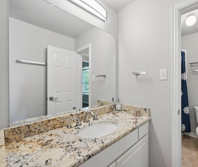14877 Snowshill Dr, Frisco, TX 75035 - bathroom featuring toilet, vanity, and tile patterned floors