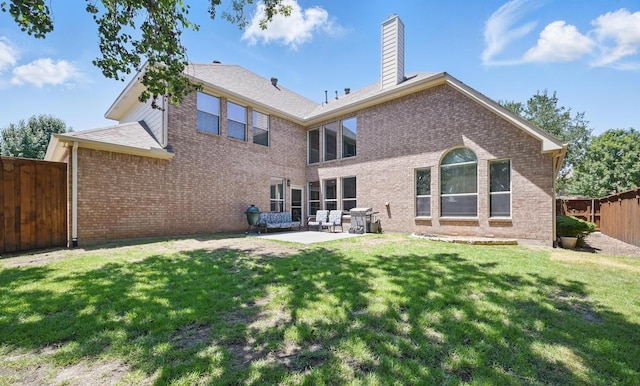 14877 Snowshill Dr, Frisco, TX 75035 - rear view of house featuring a patio, brick siding, and a chimney