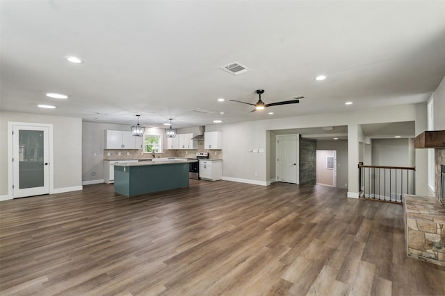 147 Carolynn Rd, Mabank, TX 75156 - unfurnished living room featuring baseboards, ceiling fan, dark wood-style flooring, and recessed lighting